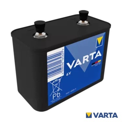 Bateria preta retangular com etiqueta azul VARTA 6V e dois terminais metálicos no topo
