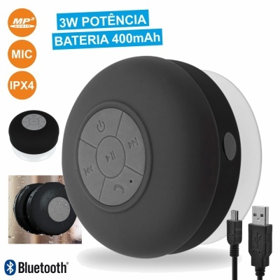 Coluna portátil preta com botões de controlo circulares e cabo USB