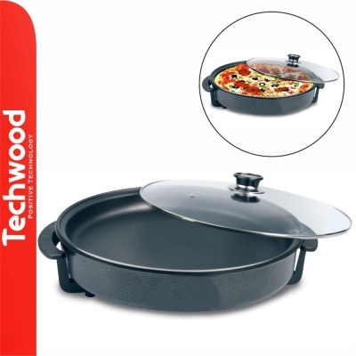 frigideira redonda preta com tampa transparente e pizza
