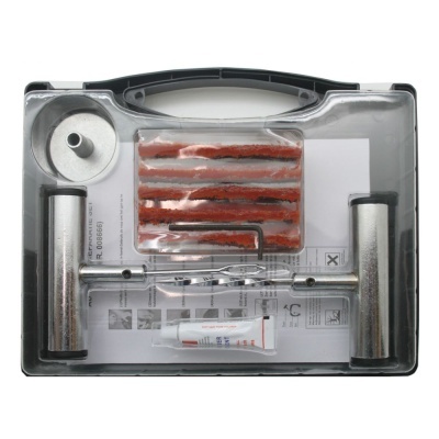 Conjunto de reparação para pneus com peças metálicas, tiras vermelhas e tubo de cola em estojo plástico