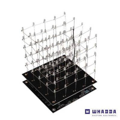 Cubo eletrônico com LEDs em matriz 3D sobre placa preta com componentes eletrônicos