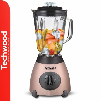 Liquidificador Techwood rosa metalizado com jarro de vidro e frutas