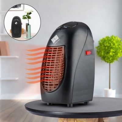 Aquecedor portátil preto com grelha castanha na mesa