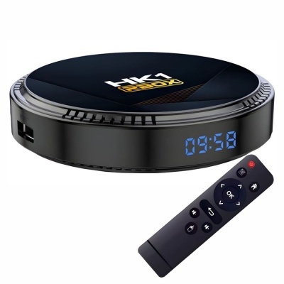 Caixa de TV digital preta redonda com ecrã digital azul e comando remoto preto