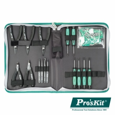 Conjunto de ferramentas Pro'sKit numa bolsa aberta com alicates, chaves de fenda, pinças e pequenas peças
