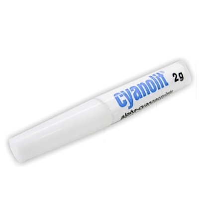 Tubo branco de cola Cyanolit 2g com texto azul e preto