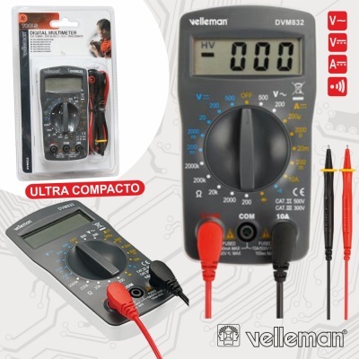 Multímetro digital Velleman DVM832 cinza com cabos de teste vermelho e preto, em embalagem plástica transparente.