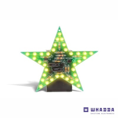 Estrela verde com luzes LED amarelas e componentes eletrónicos embutidos