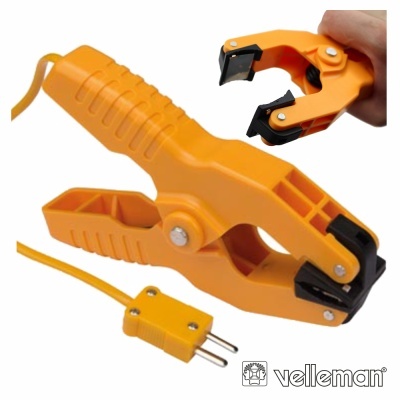 Aparelho elétrico laranja com dentes plásticos pretos e tomada