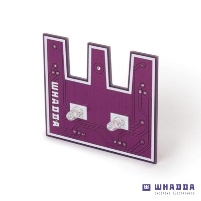 Placa eletrónica roxa com LEDs e texto WHADDA