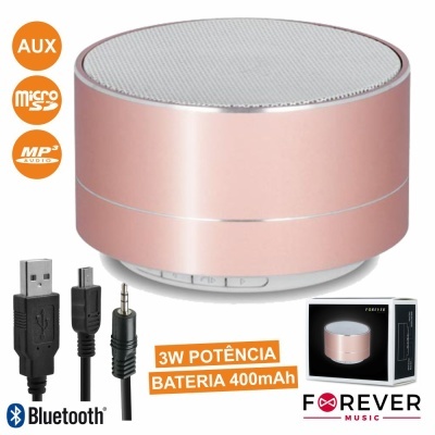 Coluna portátil Bluetooth rosa dourado com acessórios e embalagem.