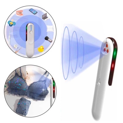 Dispositivo portátil branco com luzes, projetando ondas azuis e detectando vários objetos.