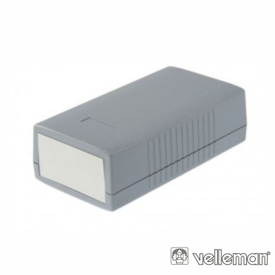Caixa eletrónica cinzenta da Velleman com superfície lisa e laterais riscadas.