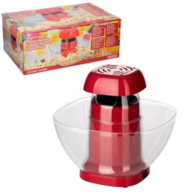 Máquina de estourar pipocas vermelha com recipiente transparente e embalagem ao fundo
