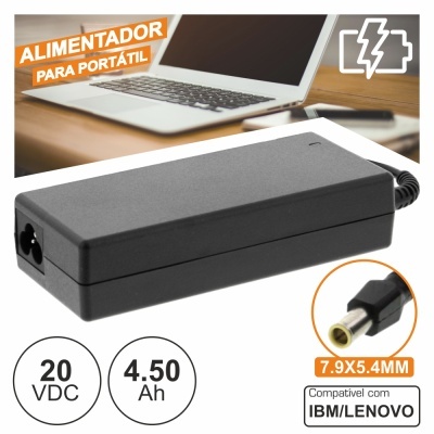 Alimentador preto para portátil compatível IBM/LENOVO junto a portátil prateado