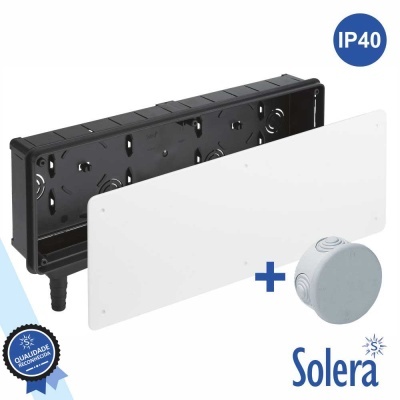 Conjunto de caixa preta com painel branco e objeto redondo cinzento