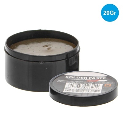 Pasta de solda em recipiente preto com tampa ao lado e etiqueta, fundo branco