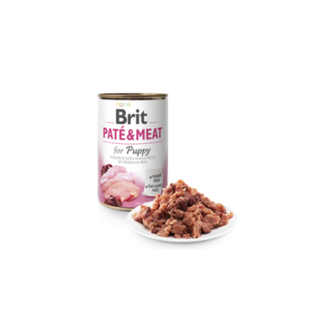 Lata de comida para cachorros Brit Paté & Meat com prato branco de comida húmida