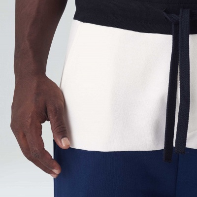 Calças de tecido bicolor com cordão na cintura