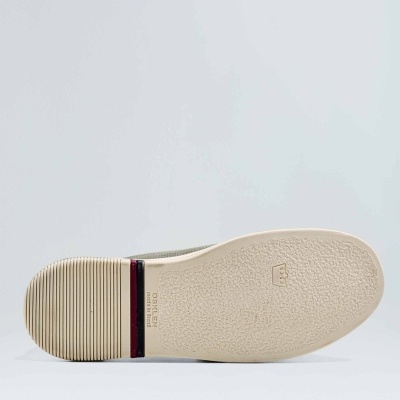 Sola de sapato bege com textura antiderrapante e texto ORIGEN CLASSIC