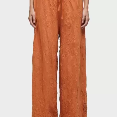 Calças largas laranja com padrão texturizado floral e cordão na cintura