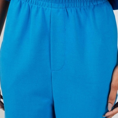 Calças de algodão azul vibrante com cós elástico