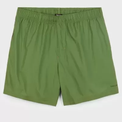 Calções verdes de tecido liso com cós elástico e marca OAKLEY.