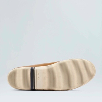 Sola de sapato bege com riscas e faixa preta