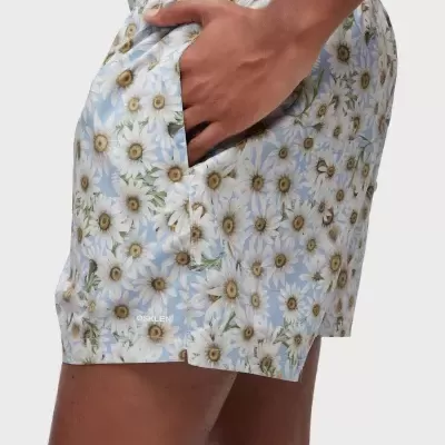 Calções de banho azuis com flores brancas e bolso lateral