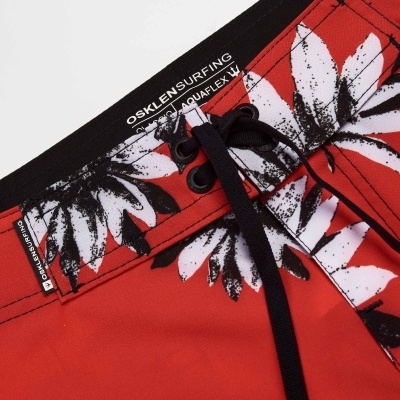 Calções de banho vermelhos com estampa de folhas e cordão preto