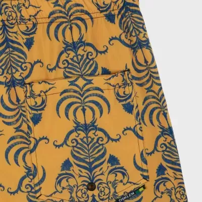 Calções amarelos com padrão floral azul e bolso traseiro com botão