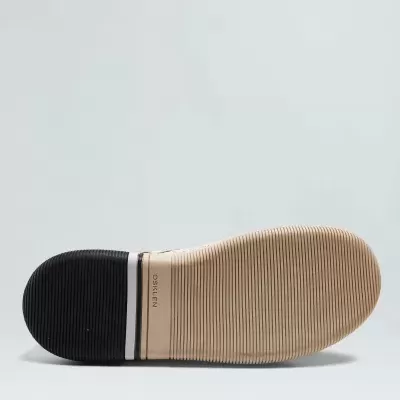 Solado de sapato bege e preto com texto POSELIEN