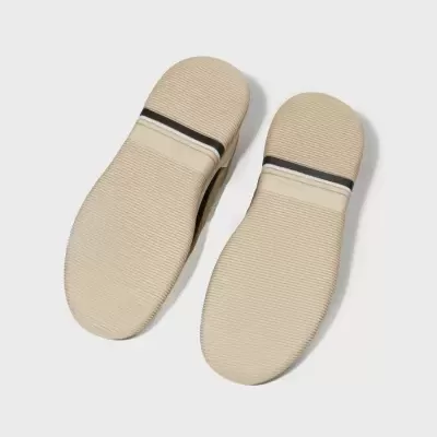 Sola de sapato bege com faixa preta