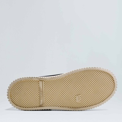 Sola de sapato bege com padrão texturizado e marca NATIVE