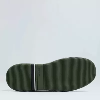 Sola de sapato verde com faixas e texto DESURE