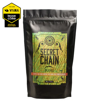 Pacote preto fosco com rótulo verde e amarelo e texto 'SECRET CHAIN BLEND'