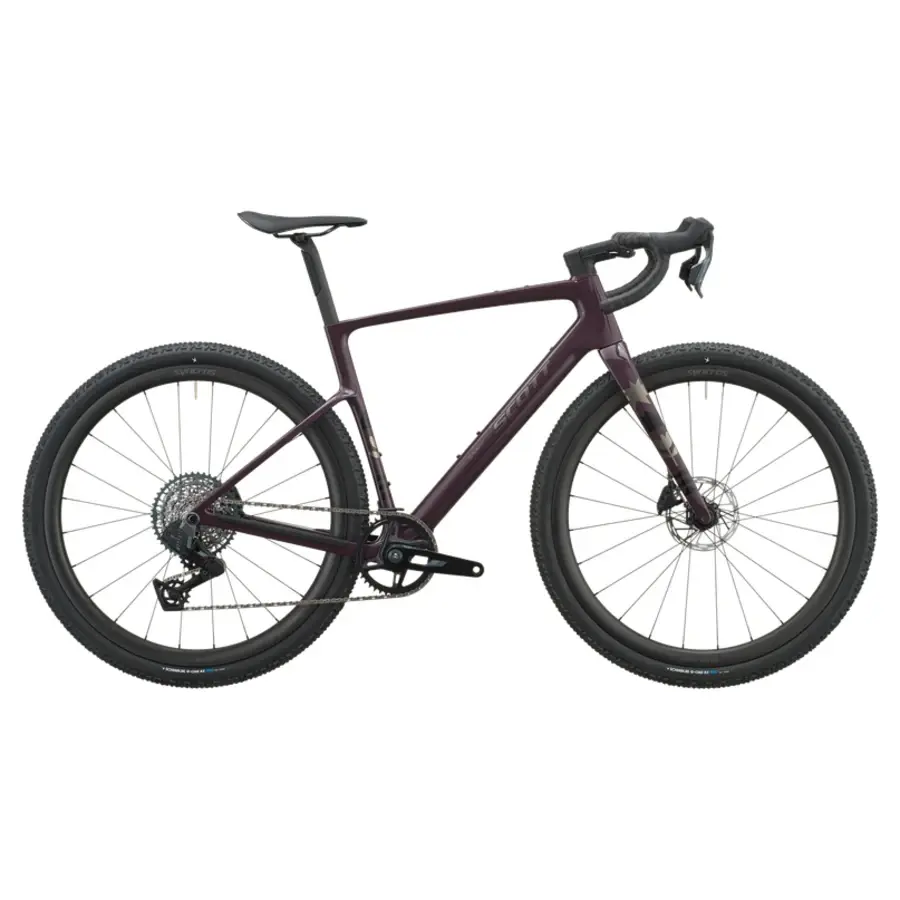 Bicicleta de montanha preta e roxa com pneus grossos