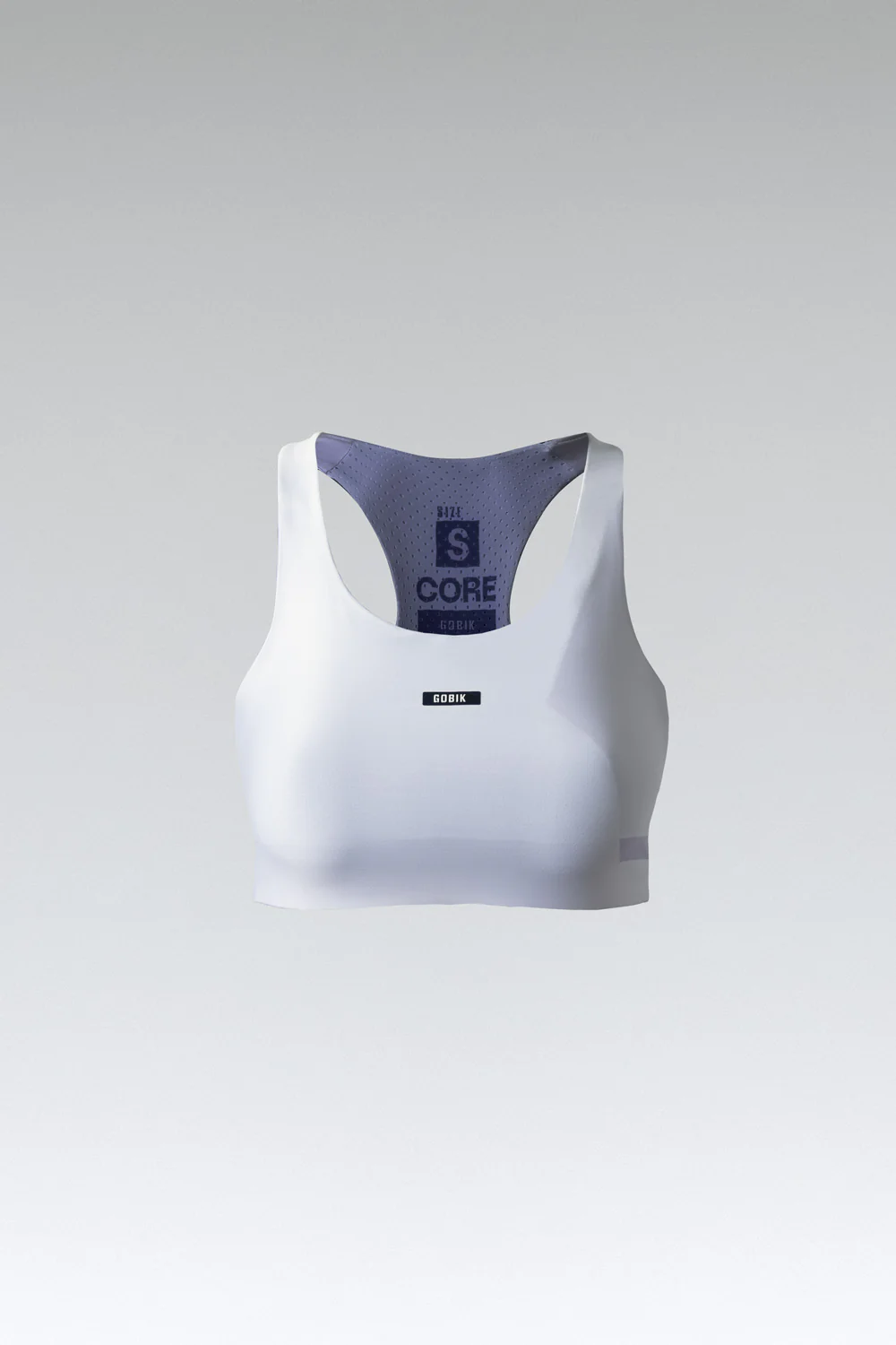 Top desportivo branco com texto CORE no forro e parte frontal