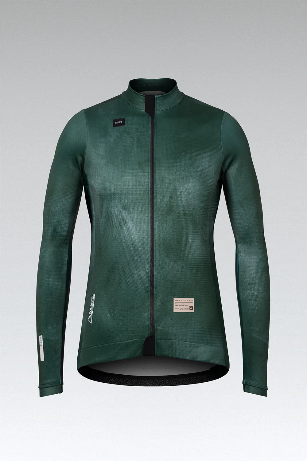 Casaco ciclismo verde escuro com fecho preto e etiquetas visíveis