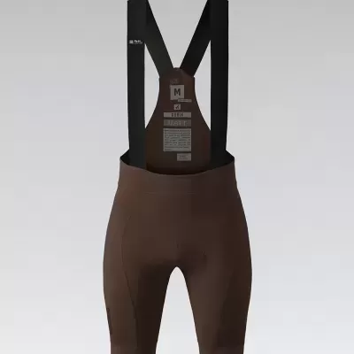 Calções de ciclismo castanhos com alças pretas e etiquetas visíveis