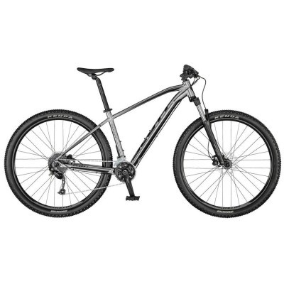 Bicicleta de montanha cinza e preto com pneus Kenda