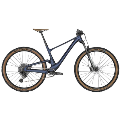 Bicicleta de montanha azul escura com pneus marrons Schwalbe vista lateral