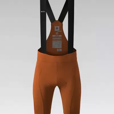 Cuecas de ciclismo castanhas com tiras pretas e etiqueta visível