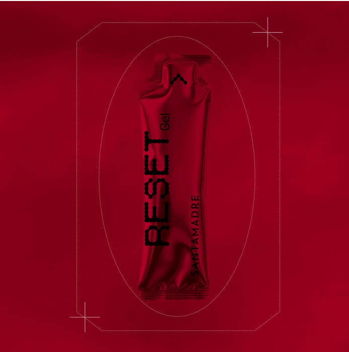 Tubo vermelho de gel RESET SANTAMADRE sobre fundo vermelho.