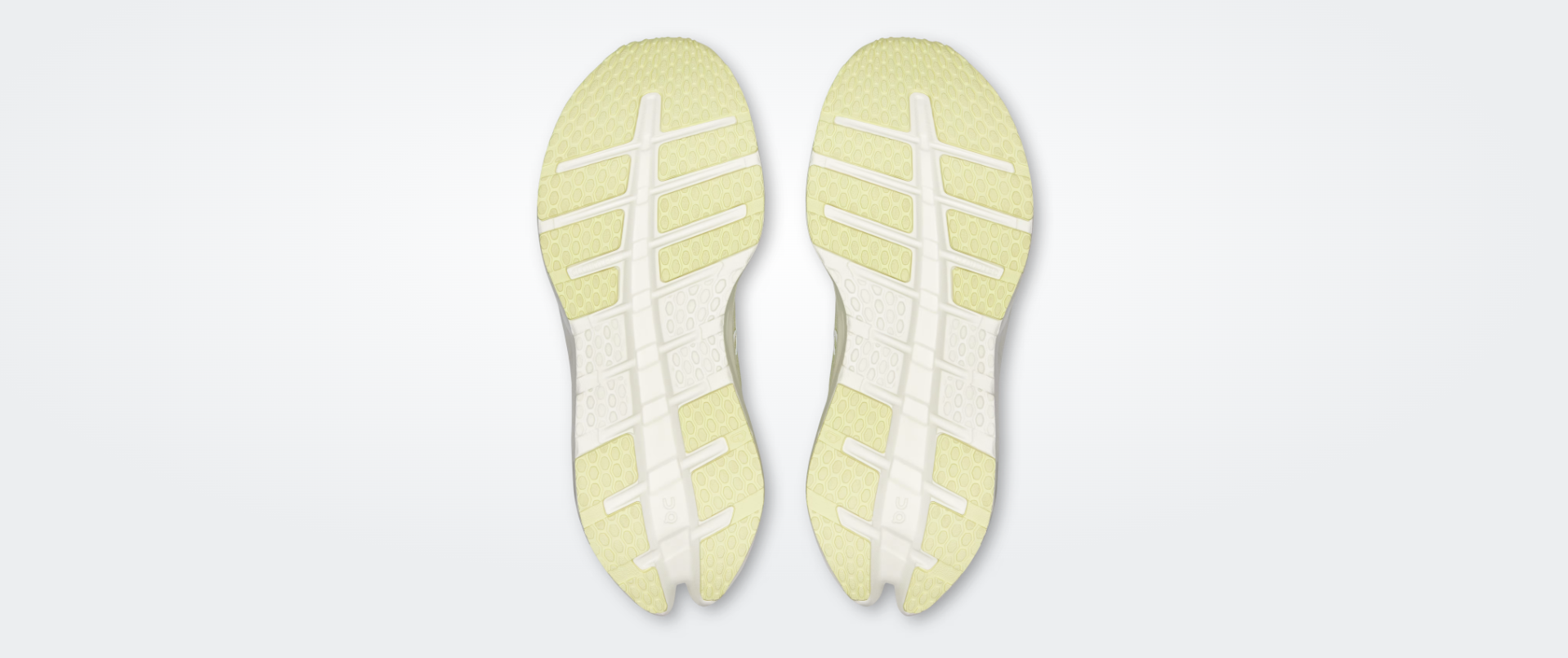 Solado de sapatilhas de corrida bege claro e branco com padrão texturizado