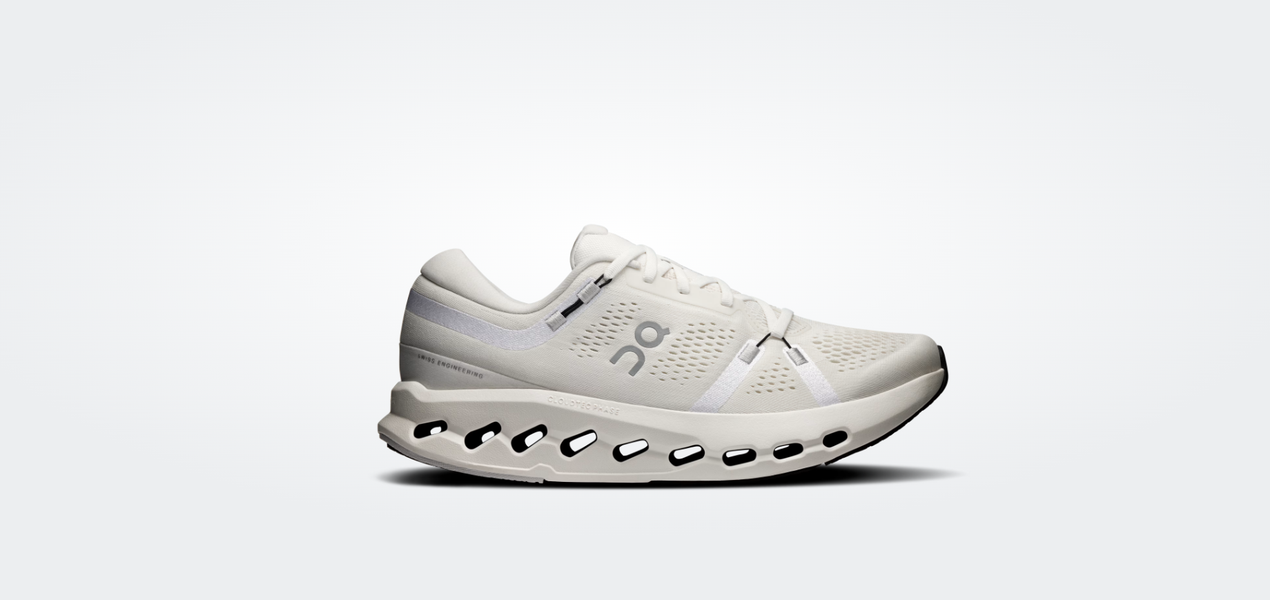 Ténis desportivo branco com sola perfurada e logótipo cinzento ON