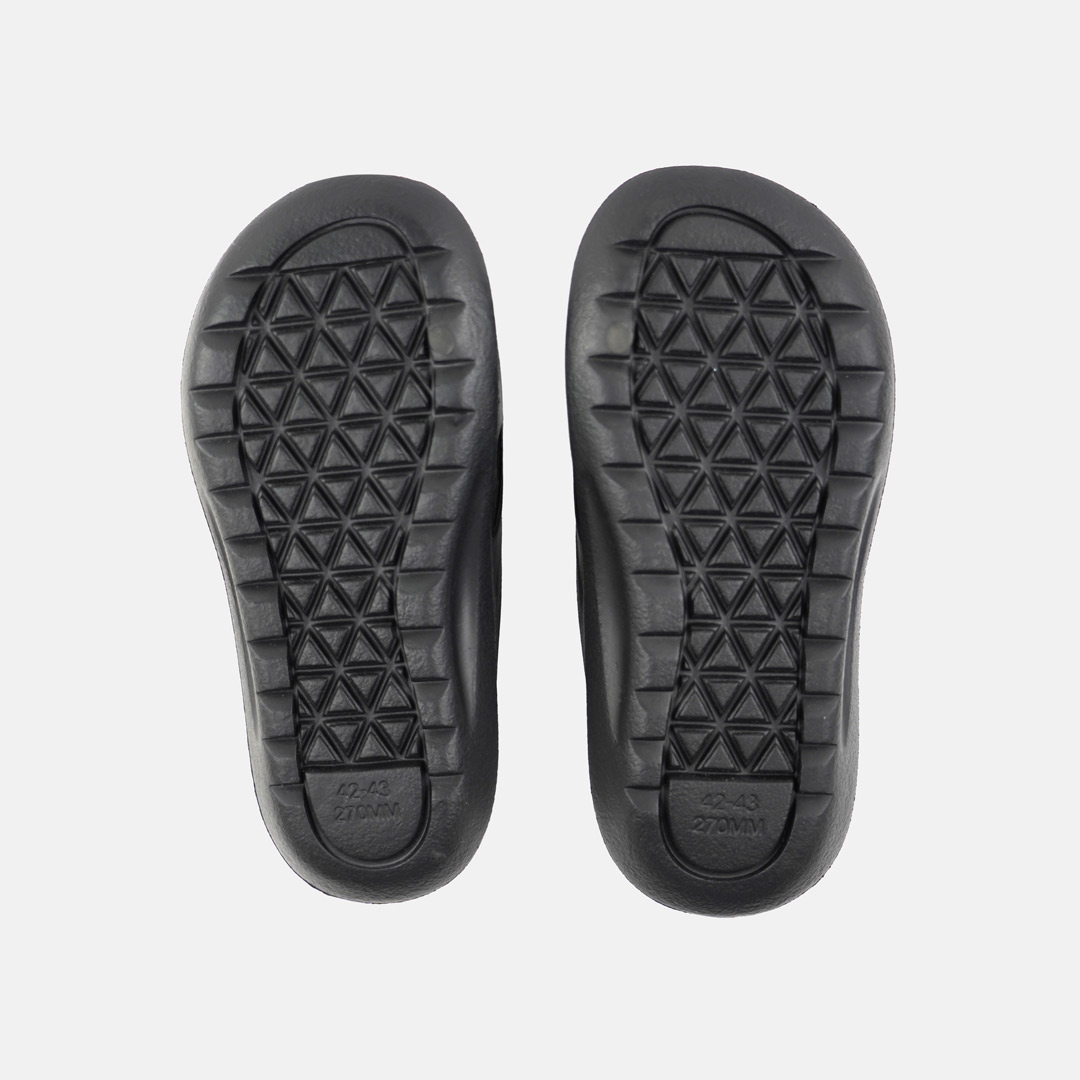 Solas de sapato pretas com padrão geométrico triangular
