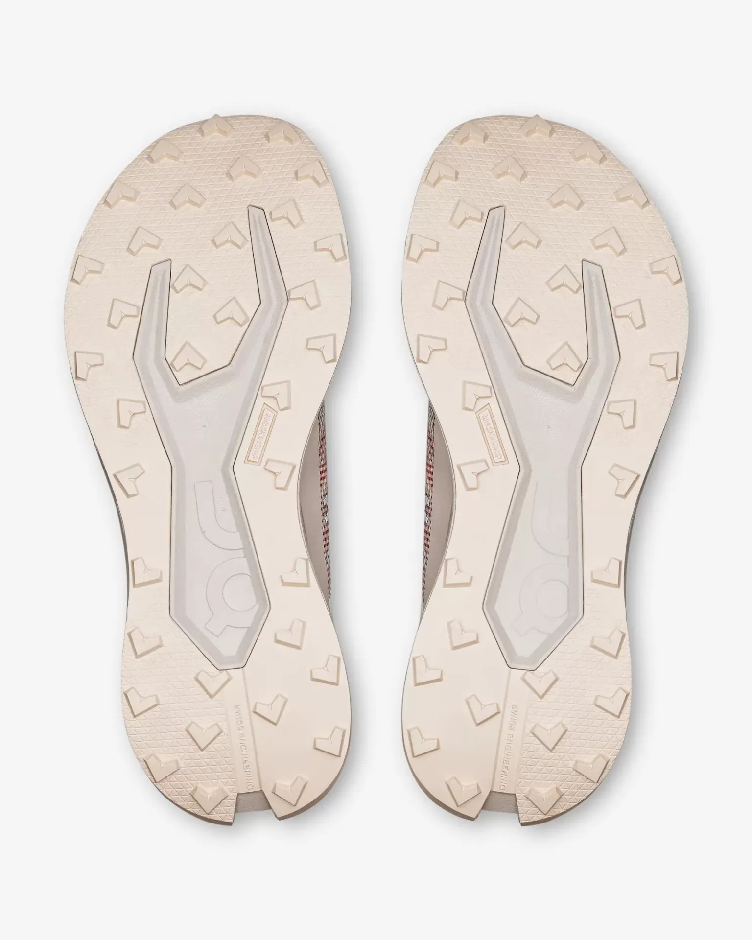 Sola de sapatos desportivos bege com padrão de adesão e texto