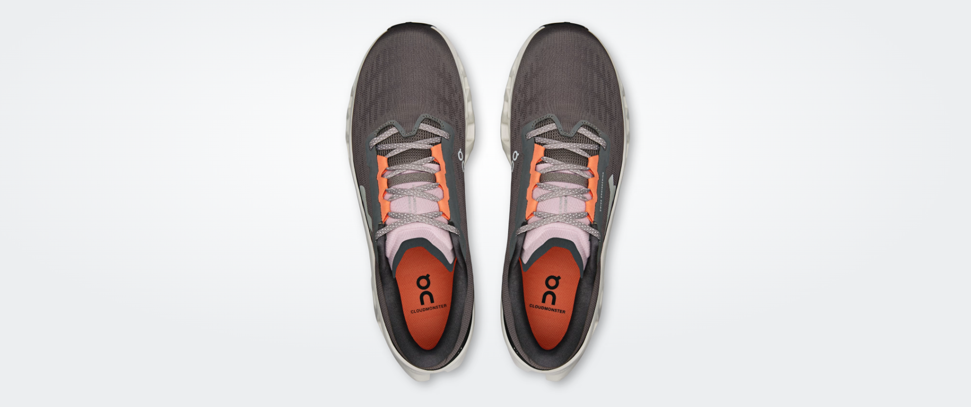 Sapatilhas de desporto cinza, laranja e rosa vistas de cima