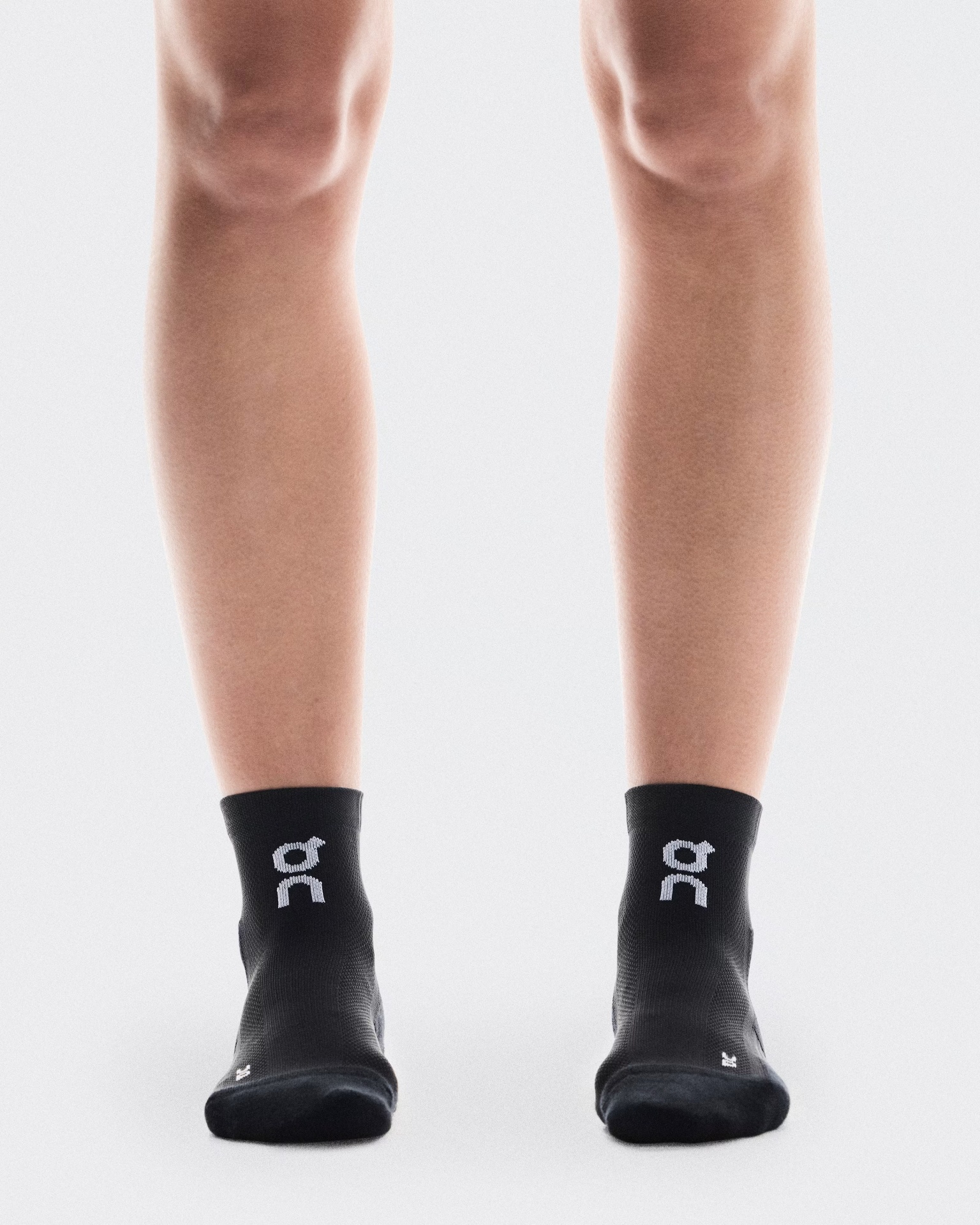 Meias esportivas pretas com logótipo branco